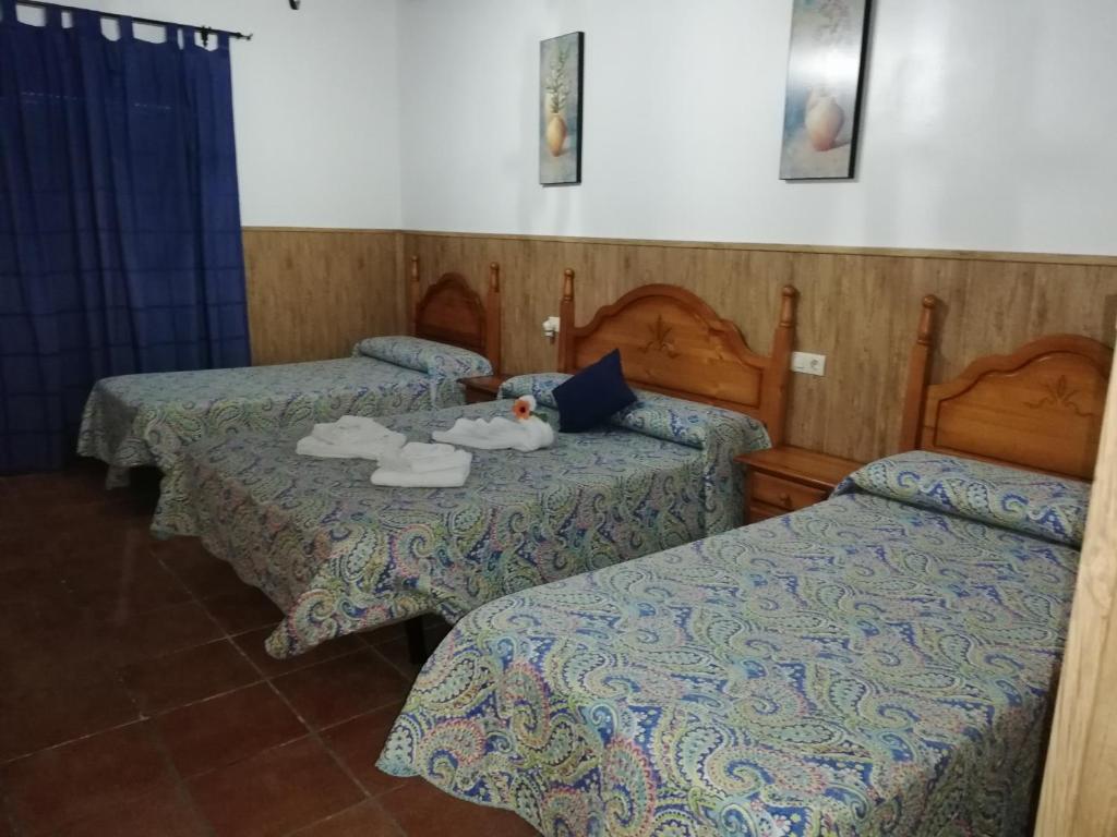 Postel nebo postele na pokoji v ubytování Hostal Breñaverde