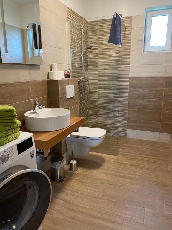 Koupelna v ubytování Apartmány Přítluky