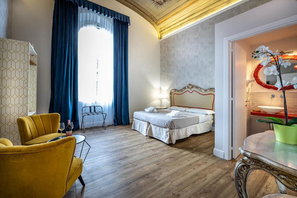 Łóżko lub łóżka w pokoju w obiekcie La Torre del Cestello - Residenza d'epoca