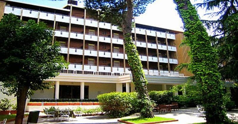 a large building with trees in front of it at Hotel Imperiale in Fiuggi