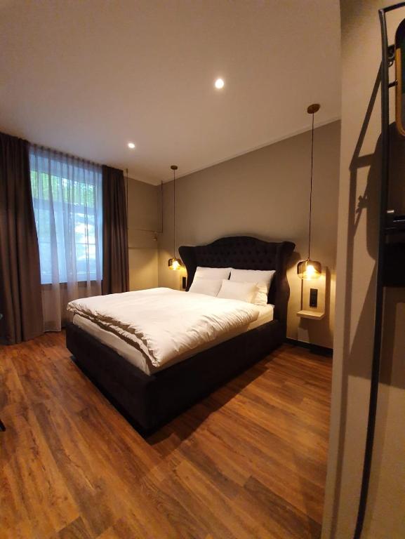 Postel nebo postele na pokoji v ubytování Munich Rooms Hotel