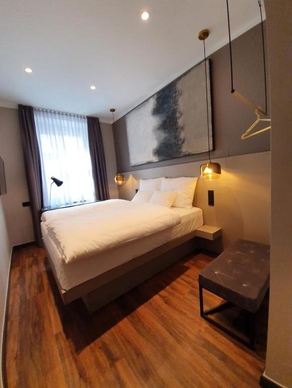 Postel nebo postele na pokoji v ubytování Munich Rooms Hotel