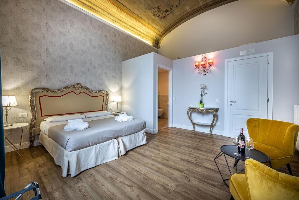 Posteľ alebo postele v izbe v ubytovaní Residenza D'Epoca Al Numero 8