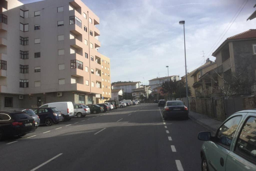a street with cars parked on the side of the road at Charming Family Large Apartment in Bragança