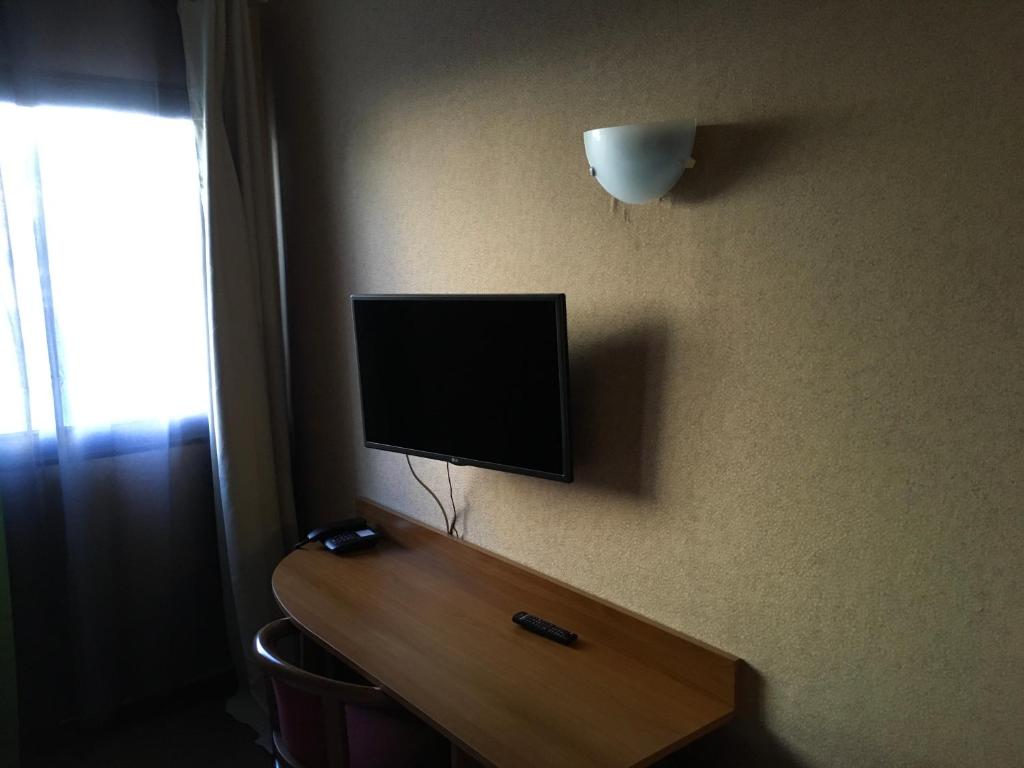 TV a/nebo společenská místnost v ubytování Hotel Dorele