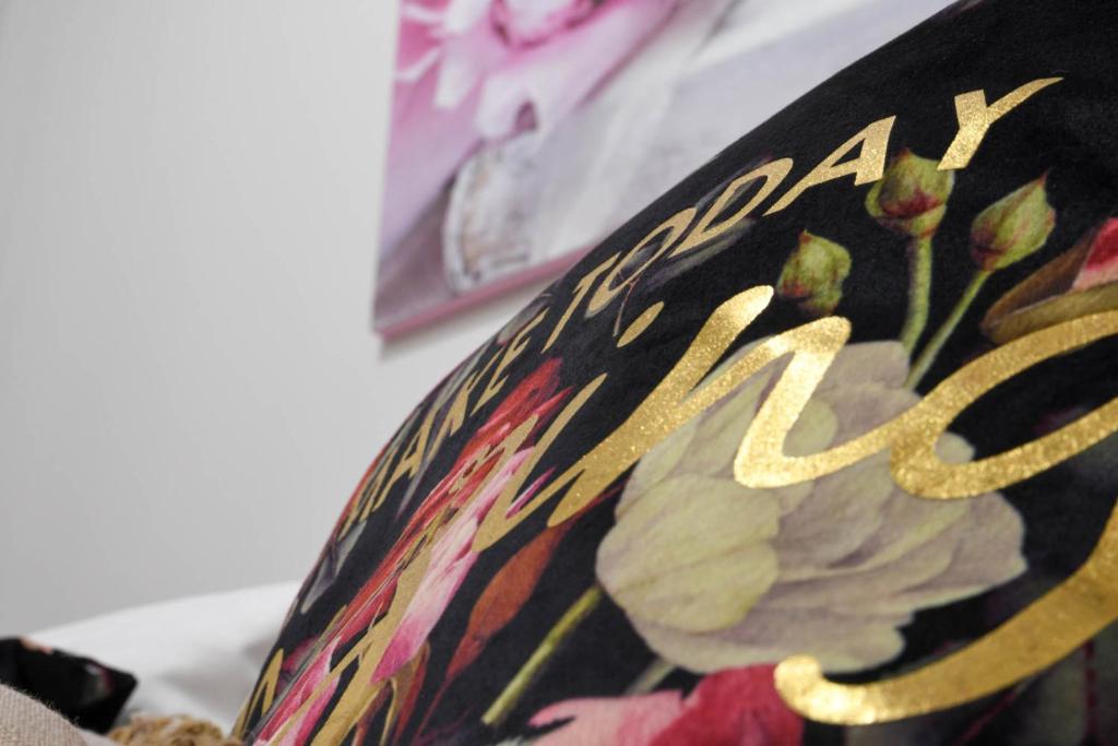 a close up of a vase with a flower on it at Orion Eco Suites in Karteros
