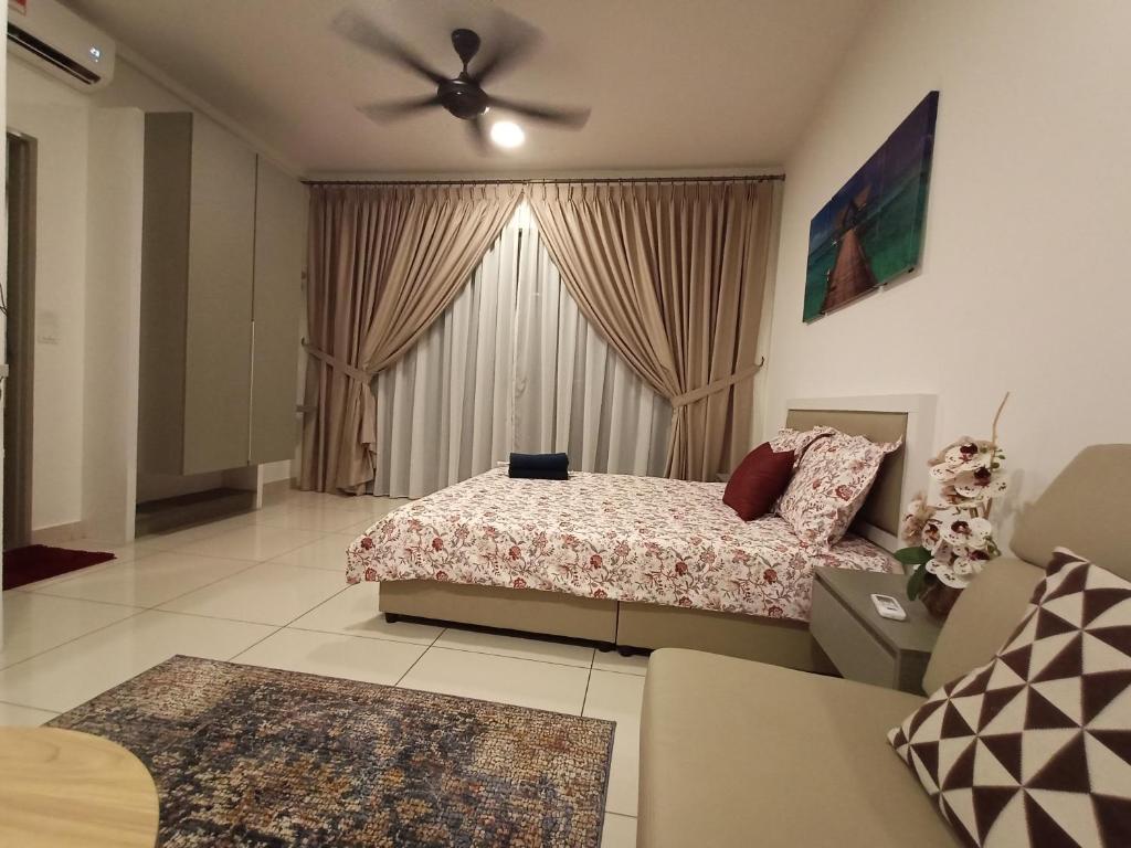 a bedroom with a bed and a ceiling fan at Nins Evo Bangi in Bangi