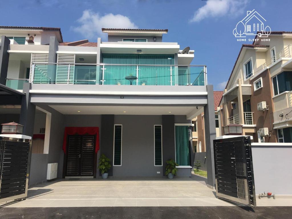 a house with a balcony on top of it at 92 Home Sleep Home Kuah Langkawi in Kuah