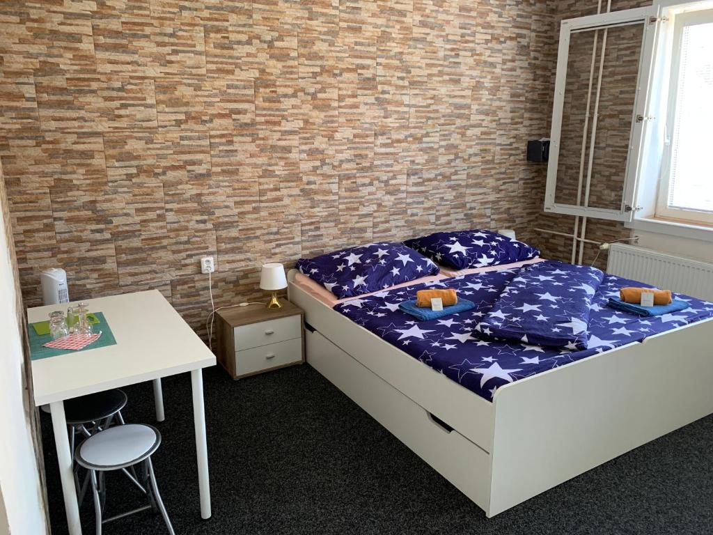 Postel nebo postele na pokoji v ubytování ZLATÁ-ÉRA