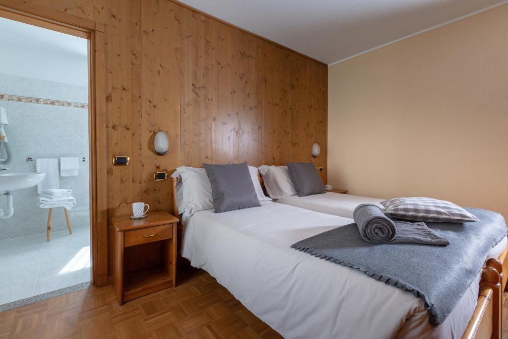 Postel nebo postele na pokoji v ubytování Hotel Cima Piazzi