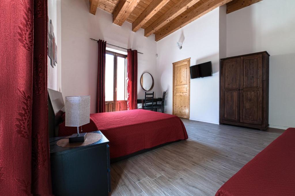 Postel nebo postele na pokoji v ubytování Decadracma rooms
