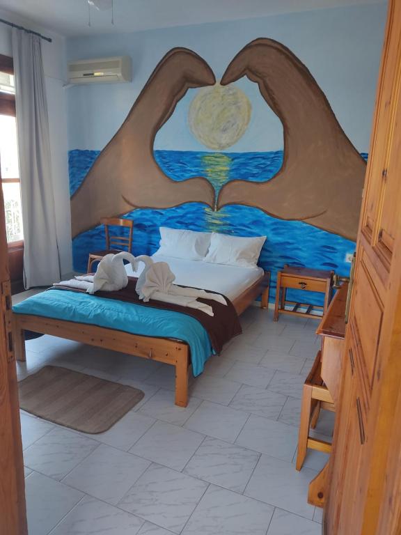 Postel nebo postele na pokoji v ubytování Amaranthos Skiathos View