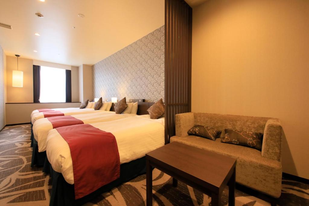 Postel nebo postele na pokoji v ubytování Quintessa Hotel Osaka Bay