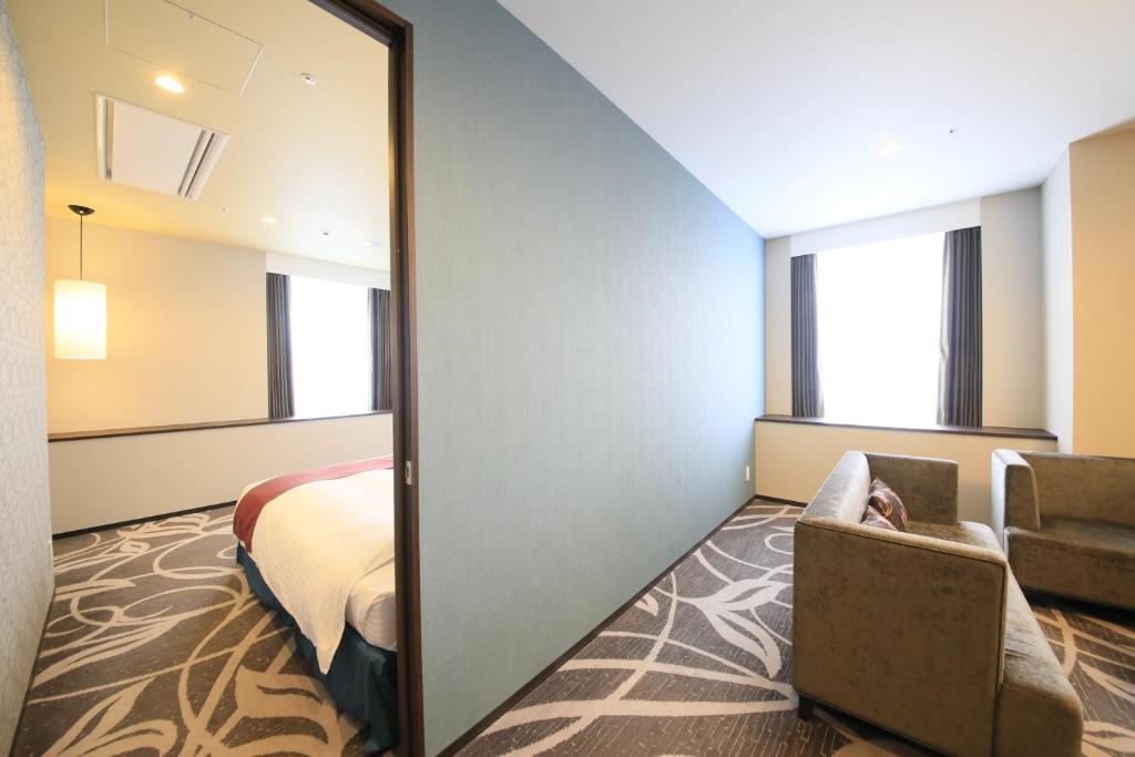 Postel nebo postele na pokoji v ubytování Quintessa Hotel Osaka Bay