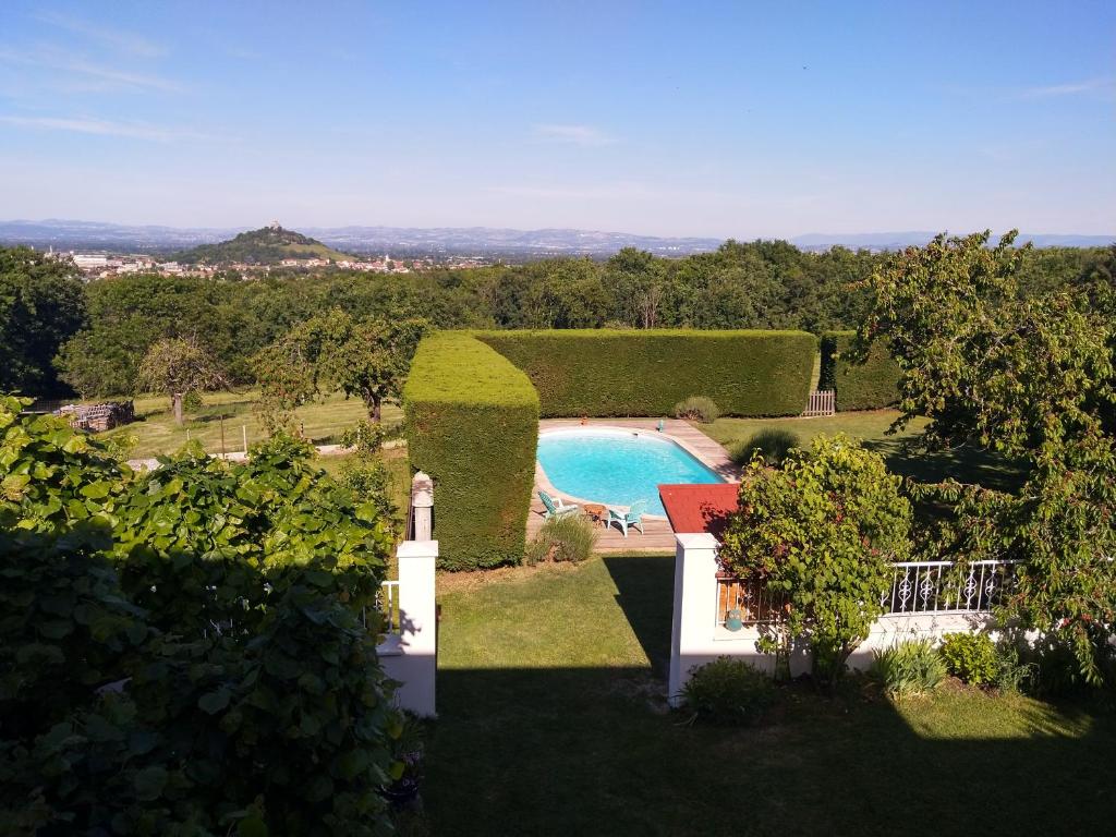 an external view of a garden with a swimming pool at Les Bessonnes in Saint-Georges-Haute-Ville