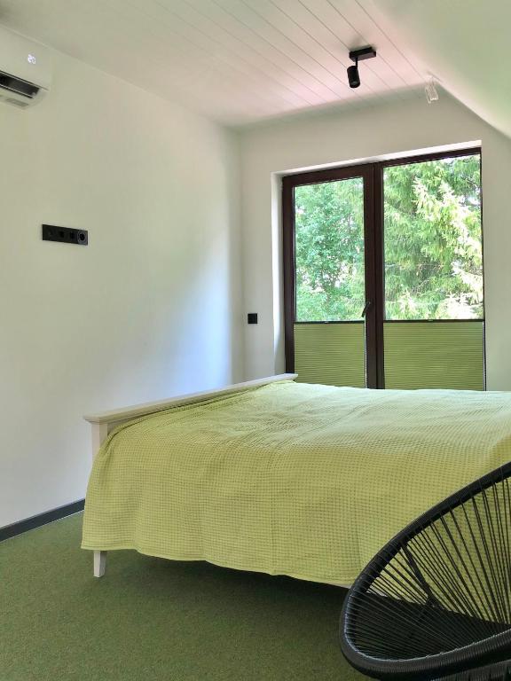 Postel nebo postele na pokoji v ubytování Holstre Paradiis