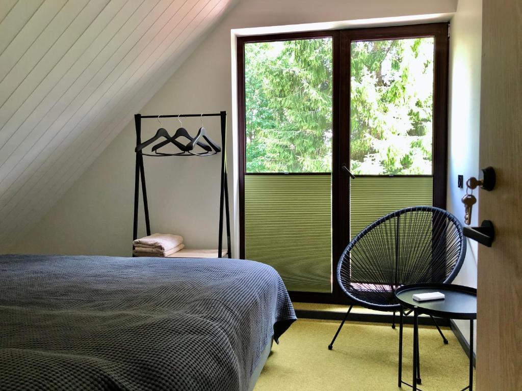 Postel nebo postele na pokoji v ubytování Holstre Paradiis