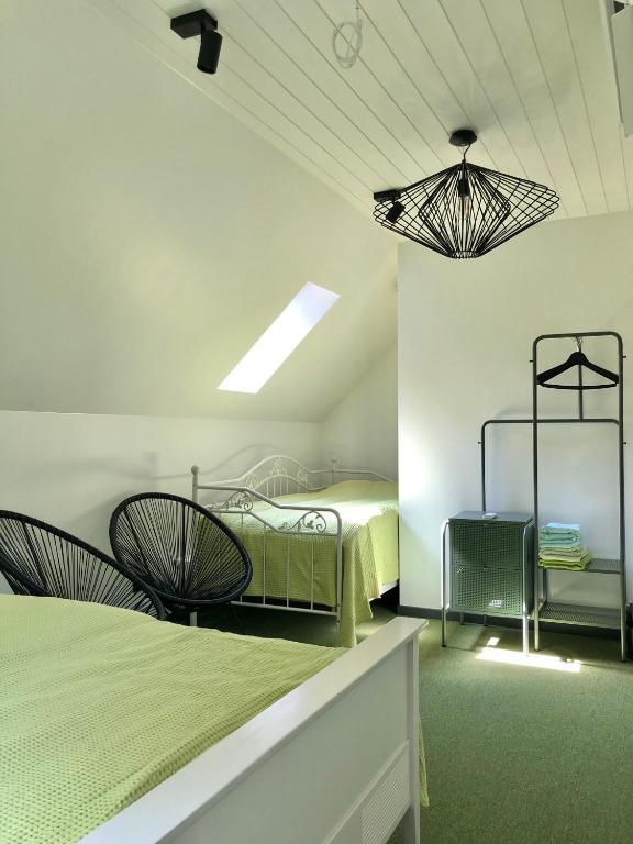 Postel nebo postele na pokoji v ubytování Holstre Paradiis