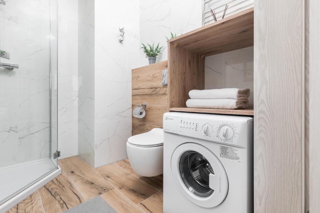 Kúpeľňa v ubytovaní Apartamenty Osiedle Bursztynowe III by Noclegi Renters