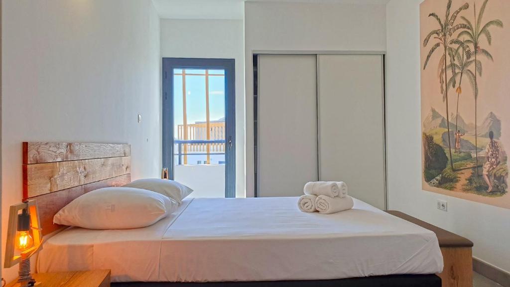 Postel nebo postele na pokoji v ubytování Appartement Etamine, l'Ermitage les Bains, proche du lagon pour 6 personnes