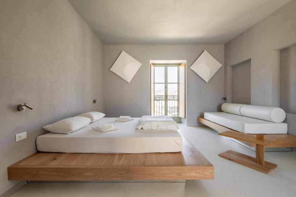 
A bed or beds in a room at Combo Torino
