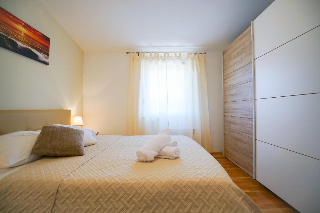 Posteľ alebo postele v izbe v ubytovaní Apartment Nicol