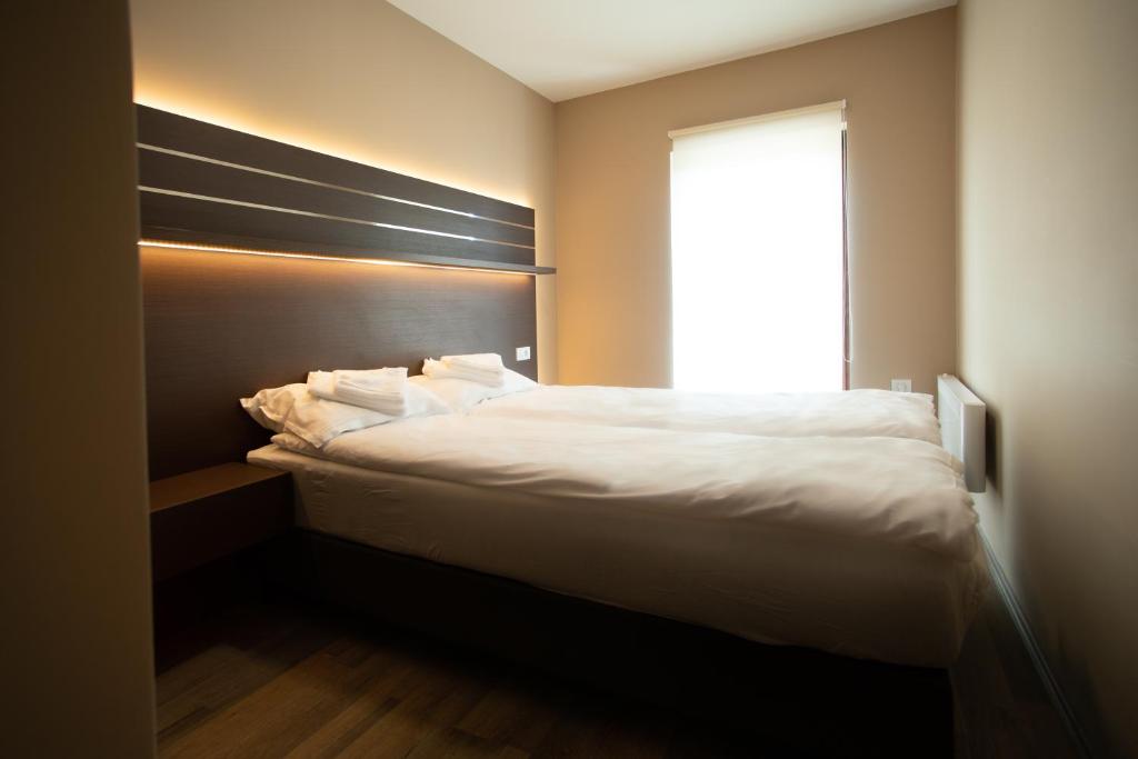 Postel nebo postele na pokoji v ubytování Belvedere Hills Luxury Apartments and Spa