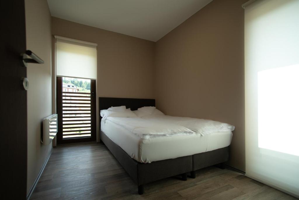 Postel nebo postele na pokoji v ubytování Belvedere Hills Luxury Apartments and Spa