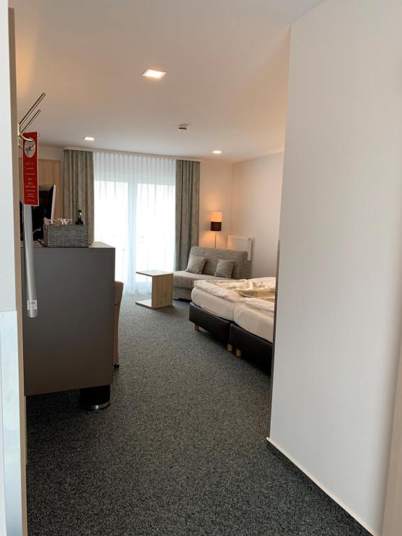 Postel nebo postele na pokoji v ubytování Stadthotel Geis