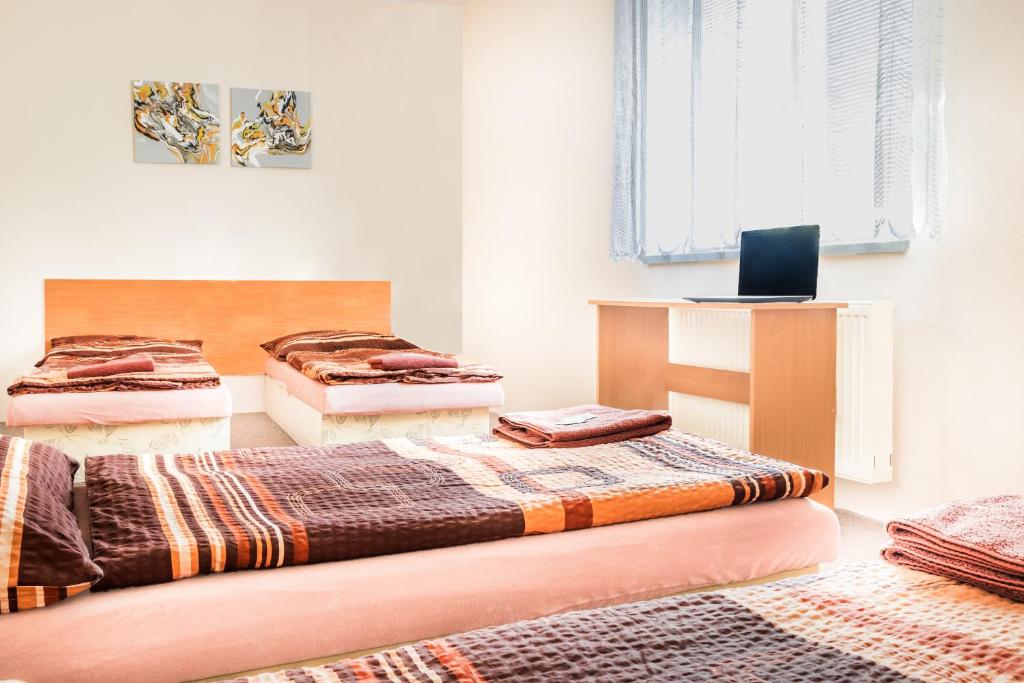 Postel nebo postele na pokoji v ubytování Hotel Zannam