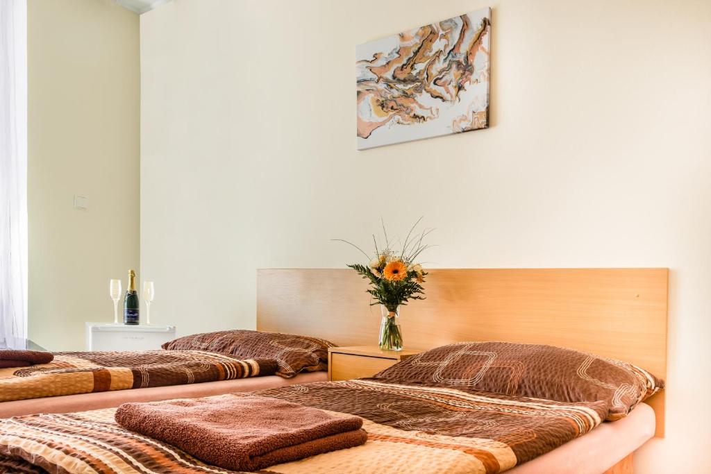 Postel nebo postele na pokoji v ubytování Hotel Zannam