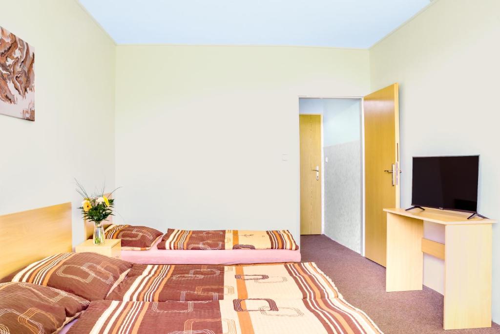Postel nebo postele na pokoji v ubytování Hotel Zannam