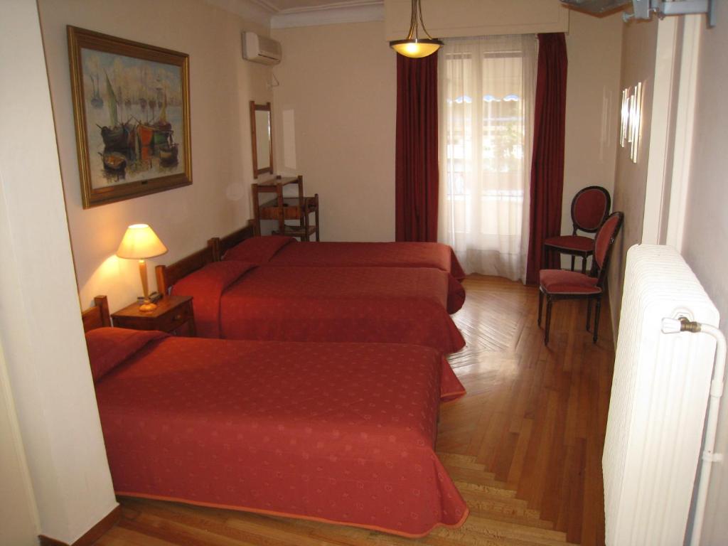 Postel nebo postele na pokoji v ubytování Art Gallery Hotel