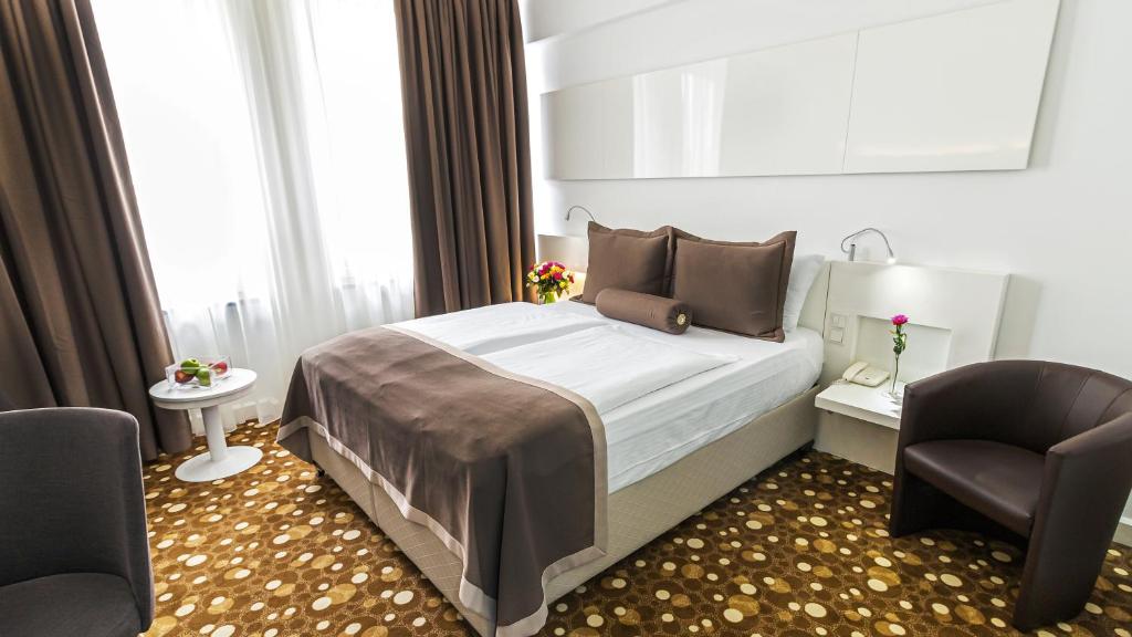 Postel nebo postele na pokoji v ubytování Hotel Bayer's