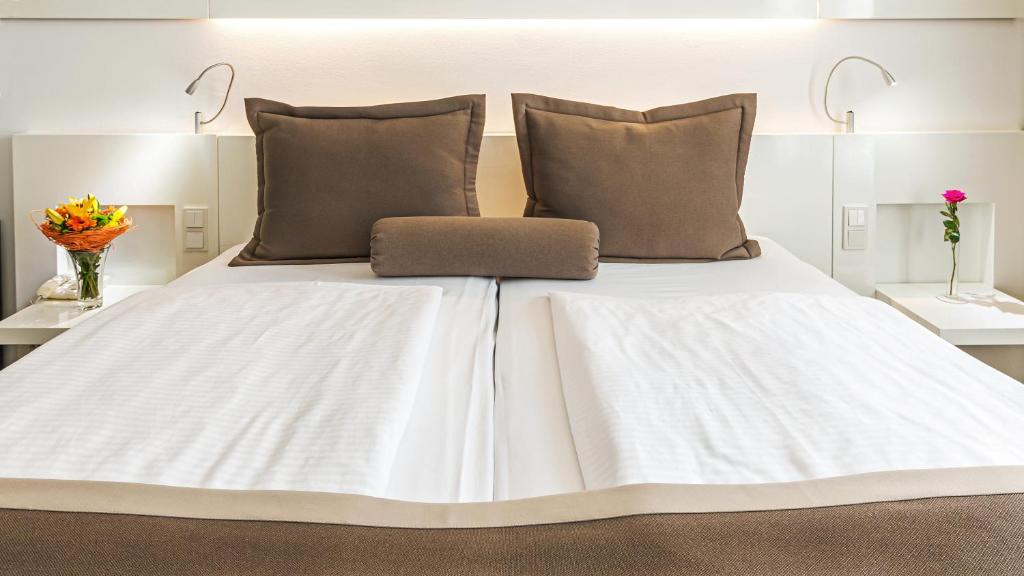 Postel nebo postele na pokoji v ubytování Hotel Bayer's