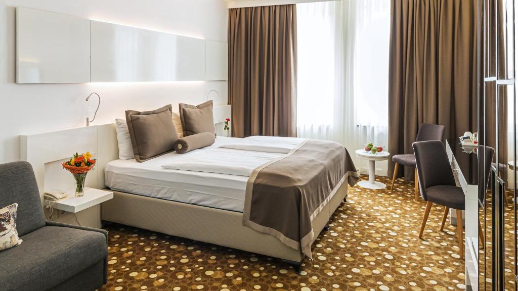 Postel nebo postele na pokoji v ubytování Hotel Bayer's