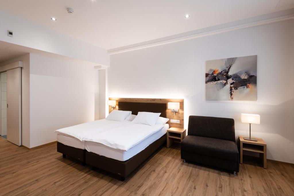 Letto o letti in una camera di Central City Hotel Rochat