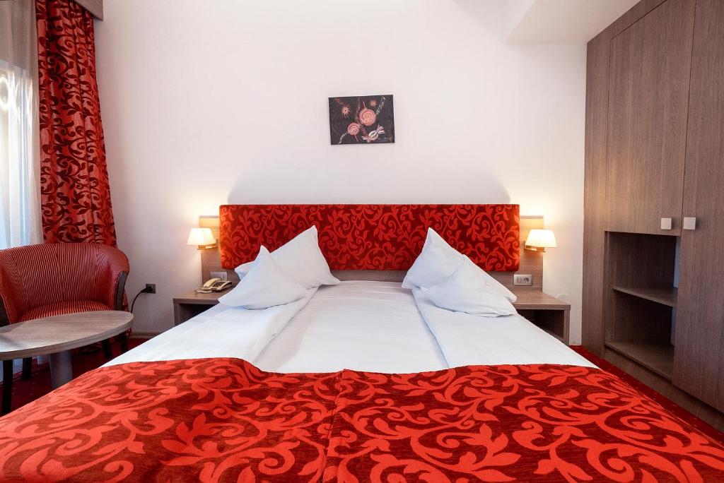 Postel nebo postele na pokoji v ubytování Hotel Tisa