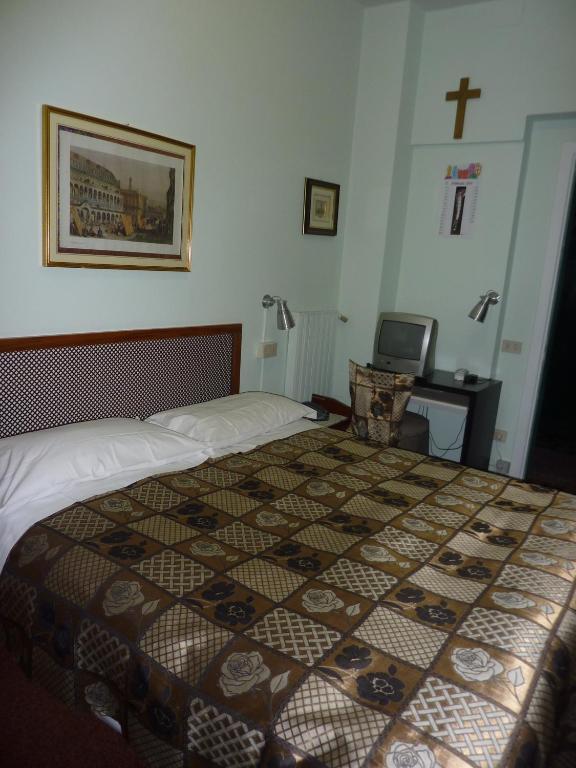 Postel nebo postele na pokoji v ubytování Albergo Junior