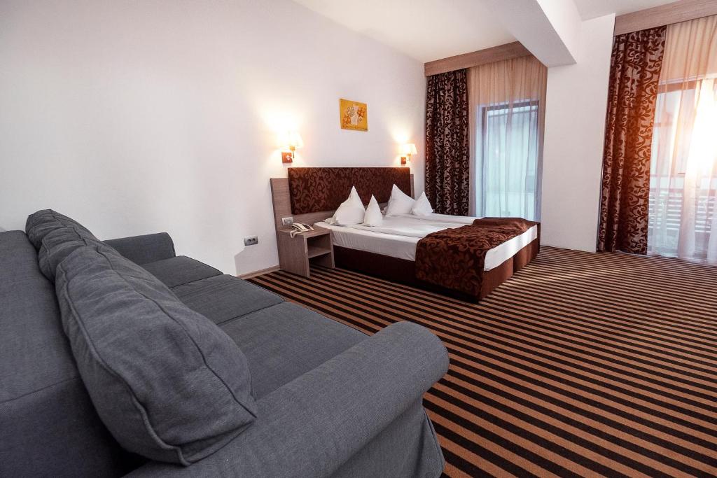 Postel nebo postele na pokoji v ubytování Hotel Tisa