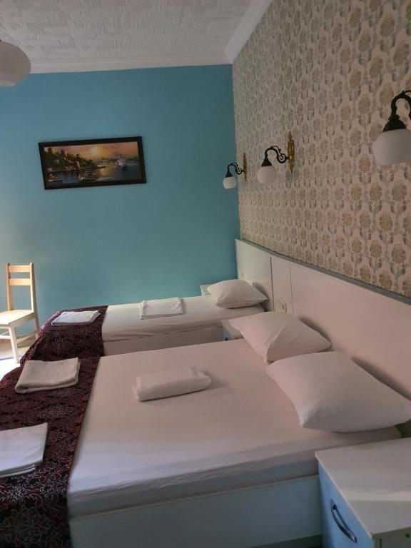 A bed or beds in a room at Tulip Guesthouse
