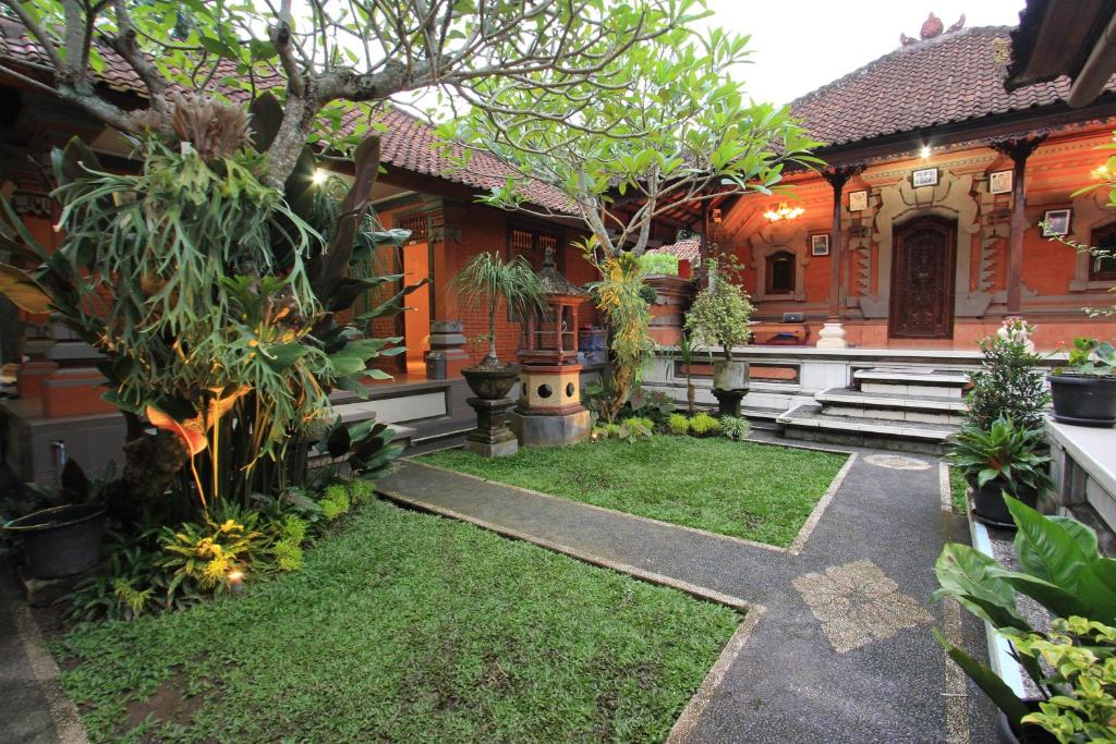 a garden in front of a house at Duana's Homestay in Ubud