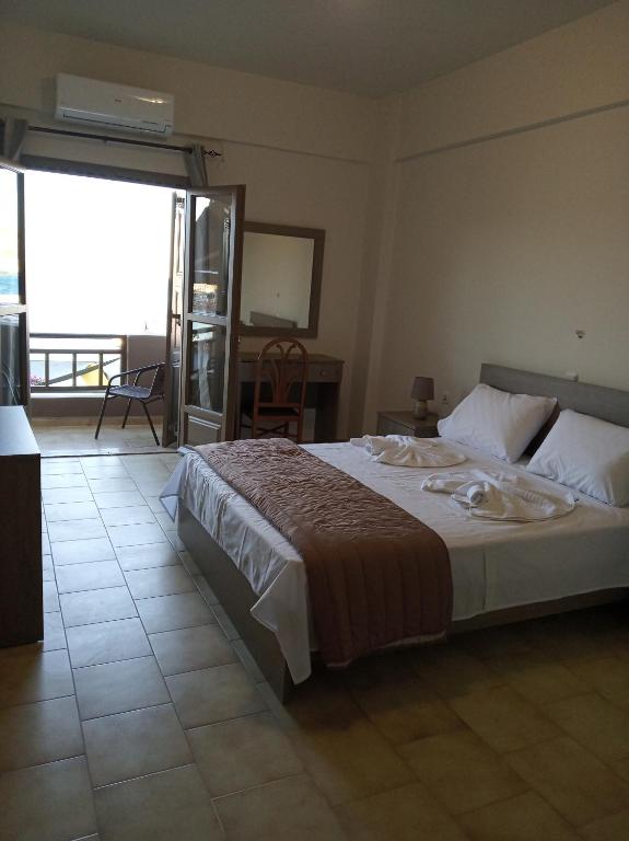 Ein Bett oder Betten in einem Zimmer der Unterkunft Buganvilla Sea View apts