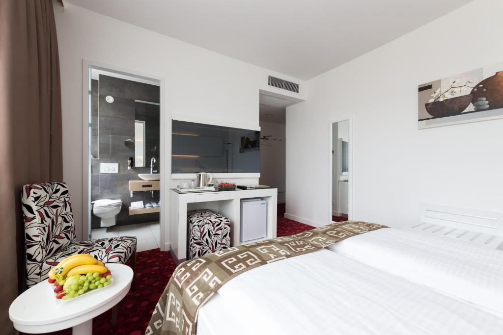 Postel nebo postele na pokoji v ubytování Hotel Bayer's