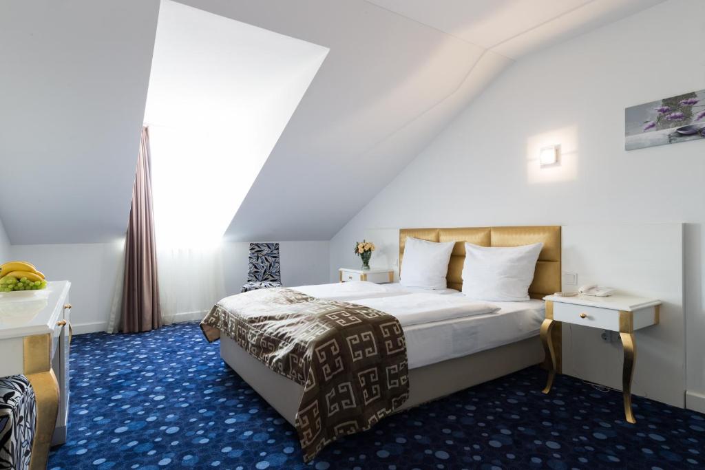 Postel nebo postele na pokoji v ubytování Hotel Bayer's