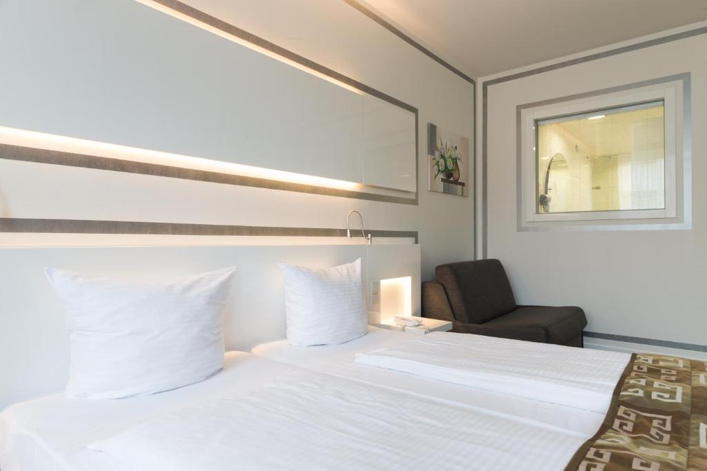 Postel nebo postele na pokoji v ubytování Hotel Bayer's