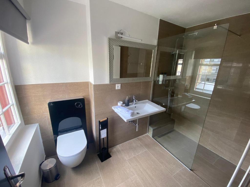 Koupelna v ubytování Hotel Boutique Taverne zum Kreuz