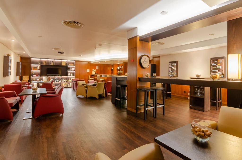 Uma área de estar em Hotel Roma