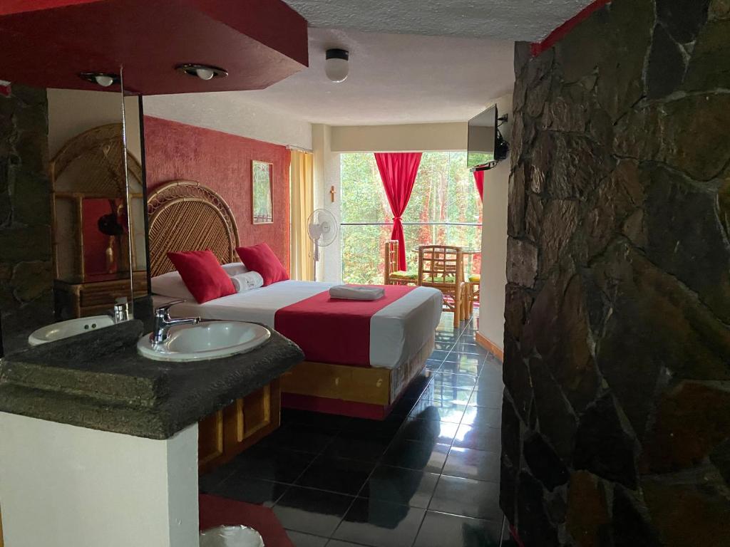 Postel nebo postele na pokoji v ubytování Hotel Alameda