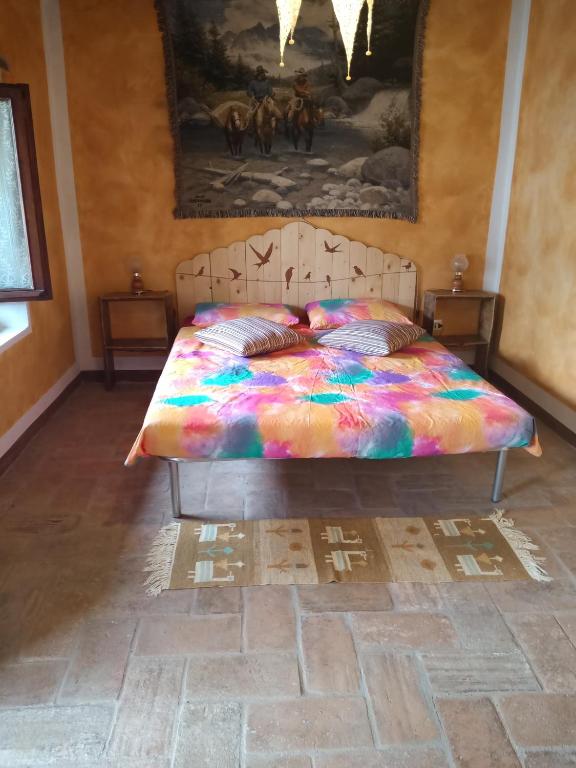 Postel nebo postele na pokoji v ubytování Bed and Breakfast Balli coi Lupi
